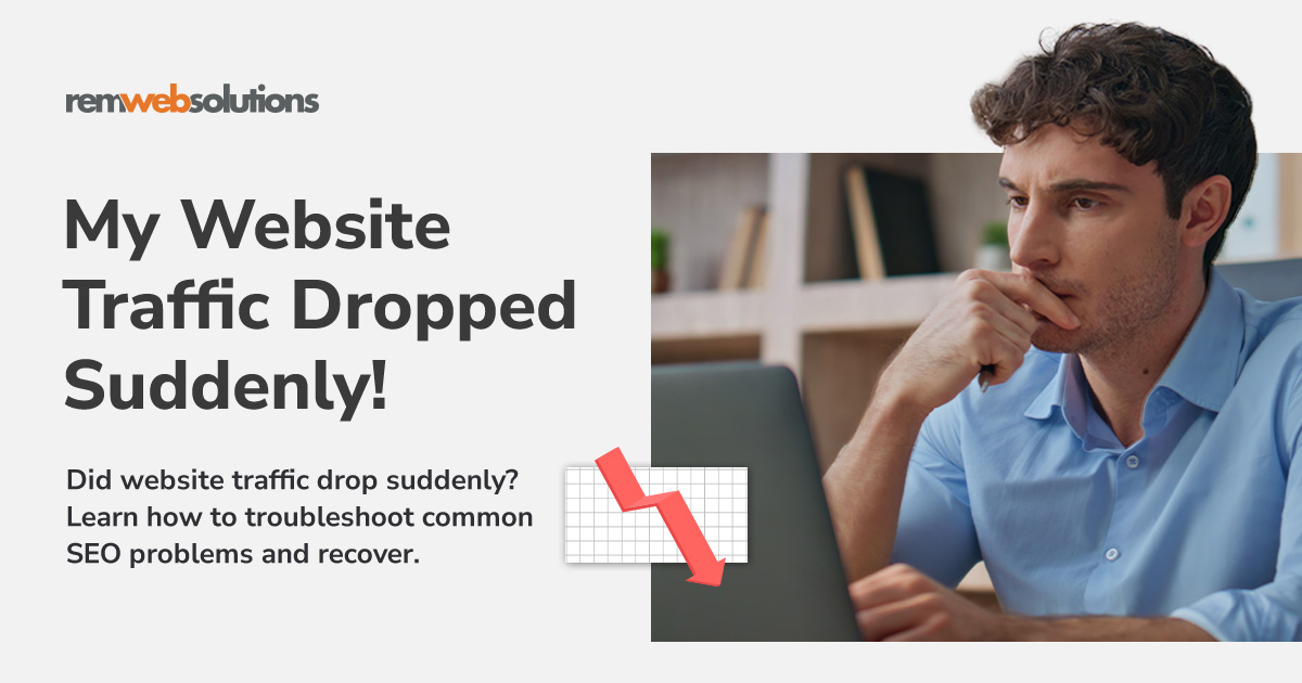 Man typing on laptop computer, looking frustrated